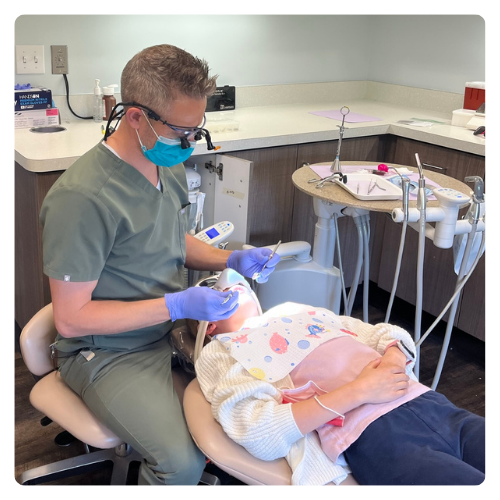 Dr. Davis providing gentle care to a young patient